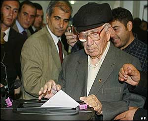 Man casts his vote in busy polling station