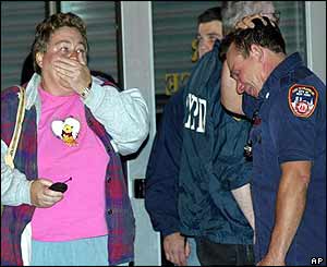 Fireman and onlooker at Staten Island ferry terminal