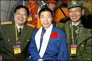 Posing with military officials on the way to Beijing