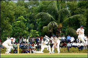 Bangladesh A's Mossader Hossain plays a cover drive 