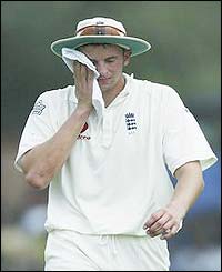 England's Steve Harmison mops his brow