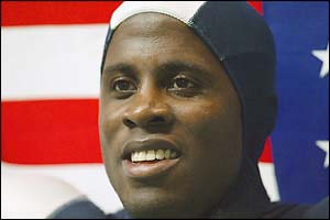 American Dwight Phillips celebrates winning gold in the long jump