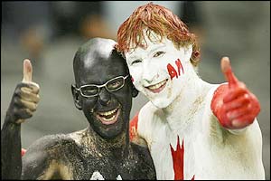 New Zealand and Canada fans pose for the cameras before the game