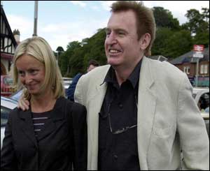 Mike McGear and companion