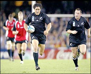 All Blacks number eight Rodney So'oialo supported by team-mate Mark Hammett scores a try