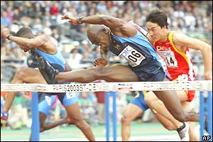 American Allen Johnson hurdles as he earns a fourth world 110m hurdles title 