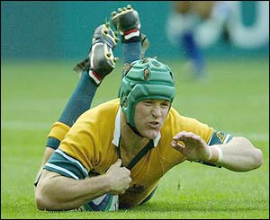 Australia's Elton Flatley scores a try against Romania
