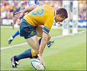 Australia's Matt Burke scores a try