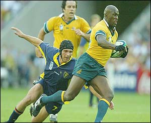 Australia's Wendell Sailor skips out of a tackle
