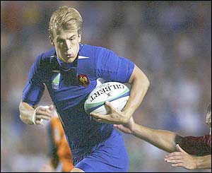 Aurelien Rougerie of France breaks away to score a try against Japan