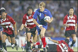 Aurelien Rougerie of France breaks away to score a try 