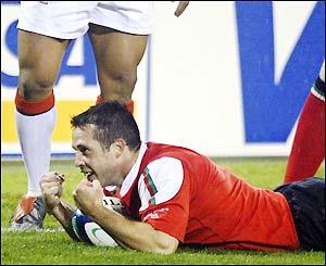 Gareth Cooper scores a try for Wales