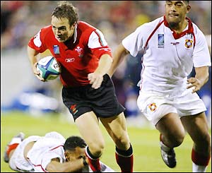 Rhys Williams charges forward to score a try