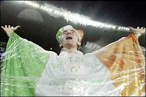 The soaked Ireland fans keep on cheering
