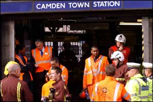 Staff and emergency services outside Camden Town Station