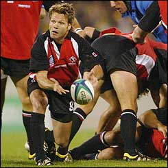 Canadian scrum-half Morgan Williams feeds the ball from base of a ruck