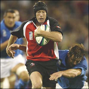Canadian full-back Quentin Fyffe sprints away on his way to scoring a try