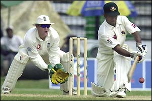 Bangladesh wicket-keeper Hannan Sarkar sweeps on his way to making 59