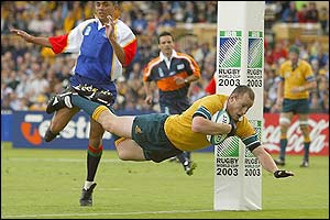 Stirling Mortlock powers through the middle for a try