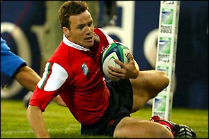 Wales' Mark Jones crosses the line to score