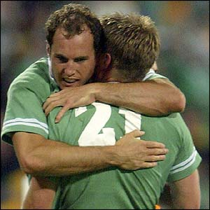 Girvan Dempsey hugs Ronan O'Gara at the whistle 