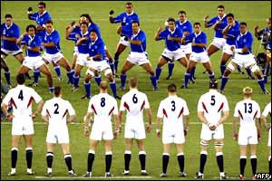 England's rugby players stare down the Samoan opposition before the kick-off