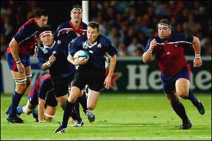 Japan fly-half Andrew Miller runs forward 