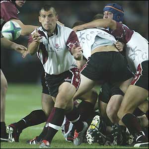 Georgian scrum-half Irakli Modebadze feeds the ball from the scrum against Uruguay