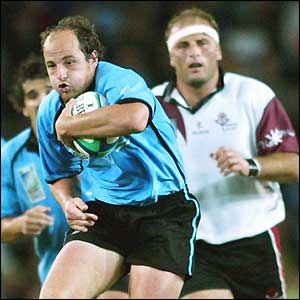 Uruguayan captain Diego Aguirre passes the ball - he later converts Alfonso Cardoso's try