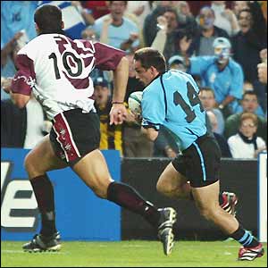 Alfonso Cardoso (bottom) squeezes over the line to score a try for Uruguay
