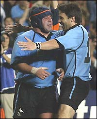 Diego Lamelas (right) in congratulated on scoring Uruguay's second try