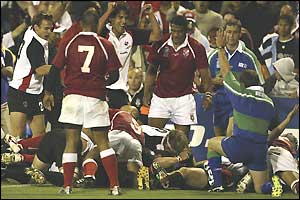 Canada celebrate scoring their second try of the match through Aaron Abrams (hidden)
