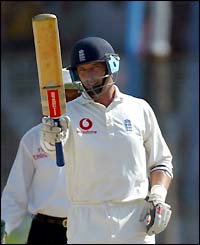 England's Nasser Hussain celebrates reaching 50 runs