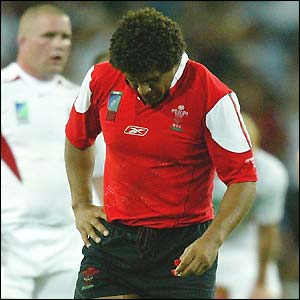 Colin Charvis, the Wales captain, hangs his head in dismay after Wales' quarter-final defeat to England
