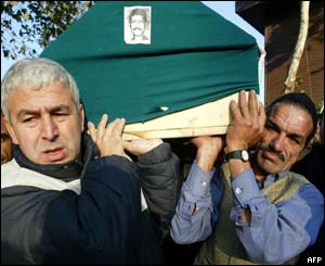 A coffin of one of the 27 people killed in the blasts is transported for burial 