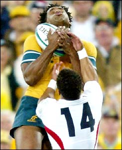 Lote Tuquiri beats Jason Robinson to Stephen Larkham's cross-field kick