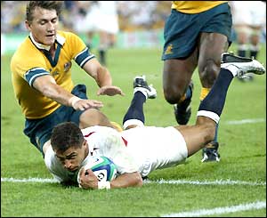 Jason Robinson slides in to score a try 