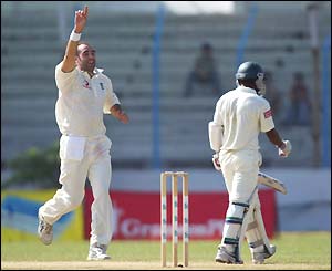 England pace bowler Richard Johnson celebrates dismissing Rajin Saleh