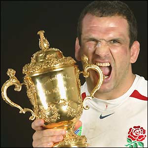 Skipper Martin Johnson finally gets his hands on the ultimate prize and lifts the Webb Ellis trophy