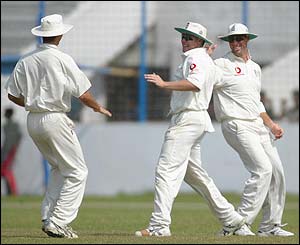 Martin Saggers is congratulated by his England team-mates 