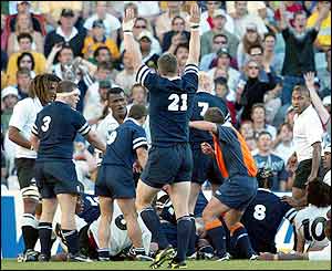 Scotland celebrate as Tom Smith scores the vital try in the 78th minute