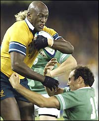Australian wing Wendell Sailor brushes off a tackle
