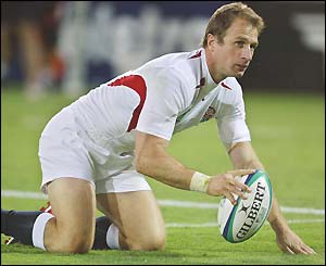 Mike Catt scores for England