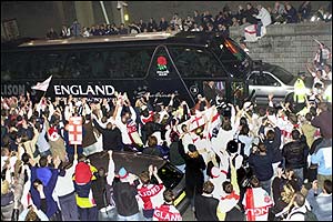 England fans mob the team bus
