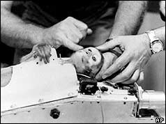 Monkey Able strapped into capsule