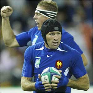 France's Olivier Magne goes over for the first try after just three minutes