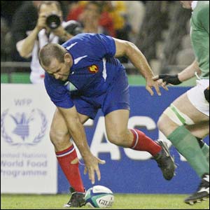 France's Jean-Jacques Crenca scores their fourth try
