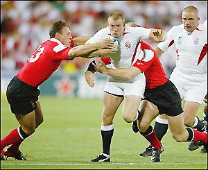 Mike Tindall tries to make a break late in the first half