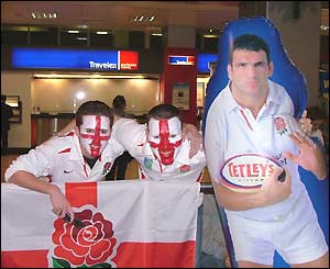 Chris and his mate Glen Ross at Heathrow with a blow-up Martin Johnson