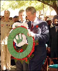 Prince Charles laid the wreath at a simple wooden cross
